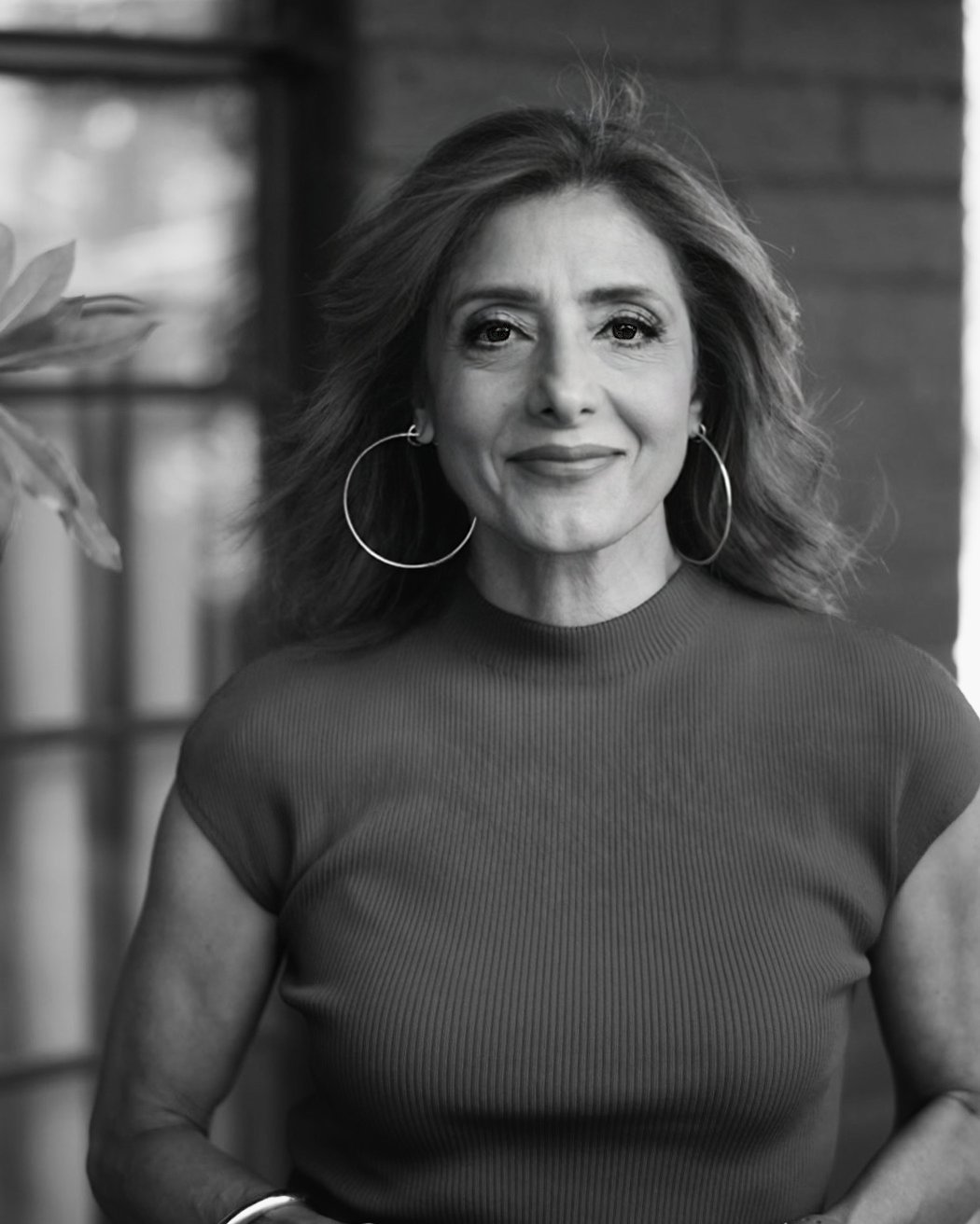 Suzi Dafnis, founder of HerBusiness, in studio portrait